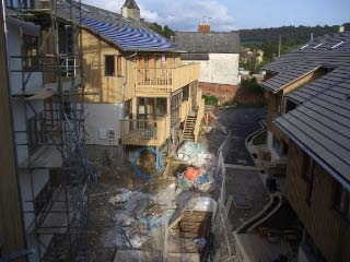  Photo of the street littered with building materials