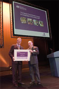  Peter Housden presents the sustainable communities certificate to the Springhill finalist, David Michael, Managing Director, Cohousing Company at the awards ceremony for the Deputy Prime Minister's Award for Sustainable Communities.